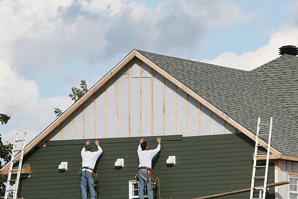 Professional Emergency Siding Repair technician working in Elyria, OH